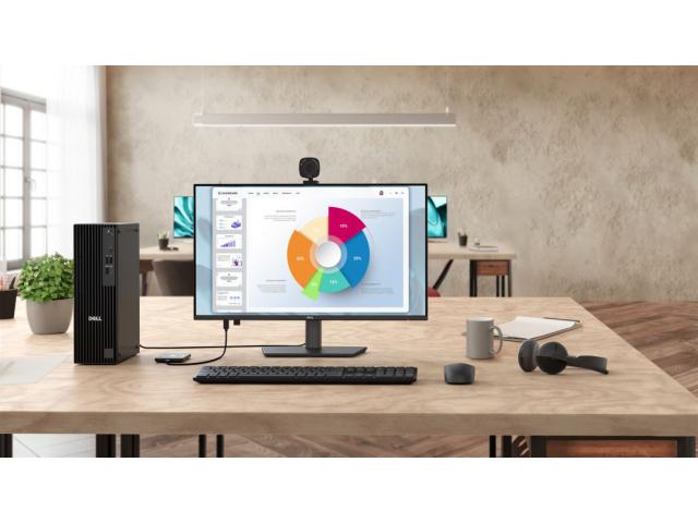 Dell Pro 27 Plus monitor na stolu, zajedno s priborom poput bežičnog miša, tipkovnice, slušalica i još mnogo toga.